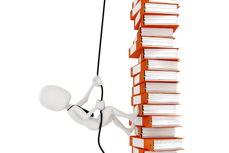 Figure climbing a tall stack of orange binders.