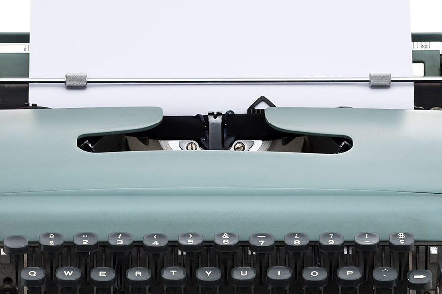 vintage typewriter with blank paper