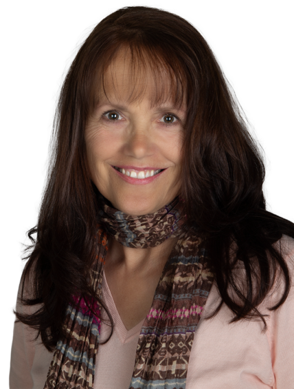 Farrell Scott, a smiling woman with long brown hair, wearing a patterned scarf and a light pink top, poses against a plain background.